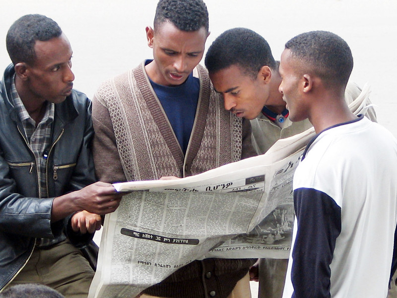 “Intensely reading the newspaper in Addis Ababa” by Terje Skjerdal, CC BY 2.0